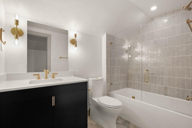 full bathroom with lofted ceiling, combined bath / shower with glass door, tile patterned flooring, vanity, and toilet