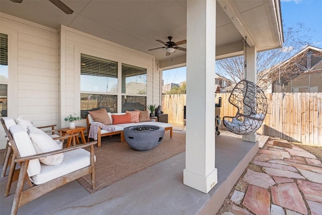 view of patio / terrace with ceiling fan and an outdoor fire pit