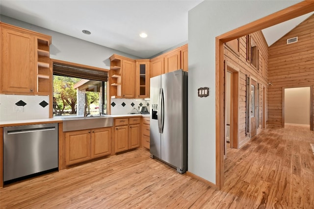 kitchen featuring visible vents, light wood-style flooring, appliances with stainless steel finishes, vaulted ceiling, and open shelves