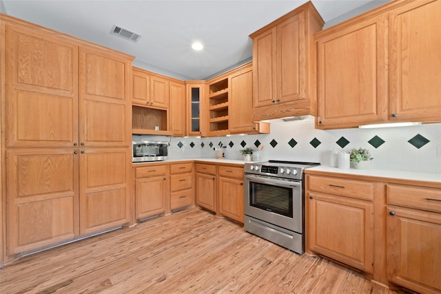 kitchen with light brown cabinets, stainless steel appliances, visible vents, light wood-type flooring, and open shelves