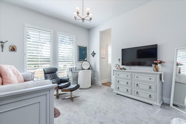 interior space with a chandelier and light carpet