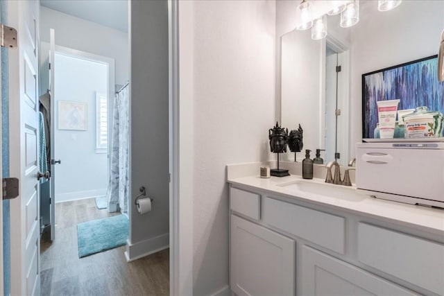 bathroom featuring vanity and hardwood / wood-style floors