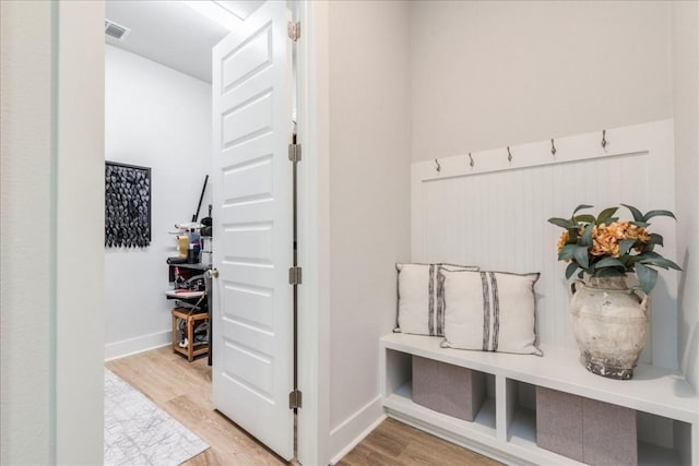 mudroom with hardwood / wood-style floors