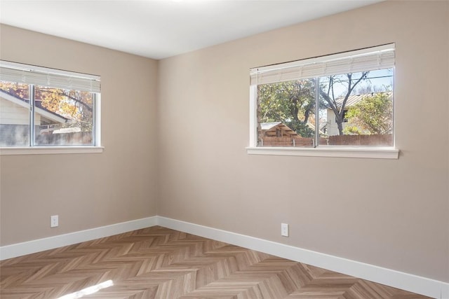 spare room with light parquet flooring