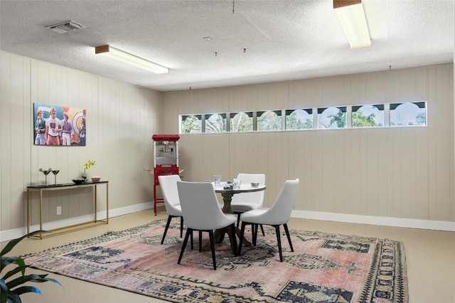 dining area with a textured ceiling