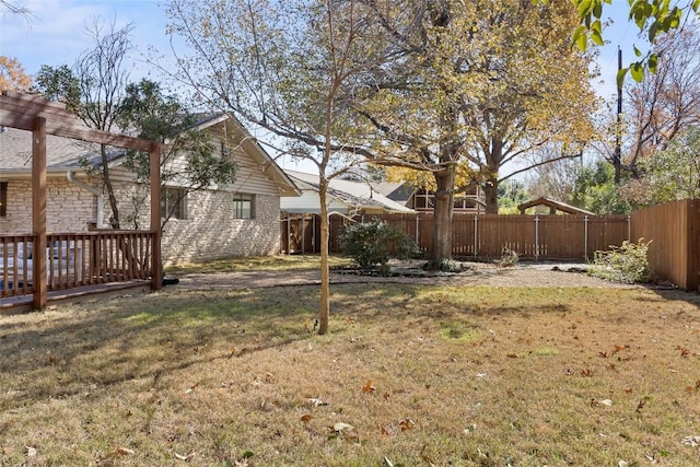 view of yard with a wooden deck