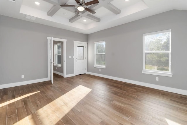 unfurnished bedroom with ceiling fan, beam ceiling, a high ceiling, coffered ceiling, and wood-type flooring