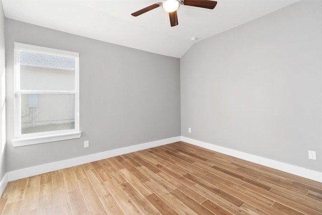 unfurnished room featuring wood-type flooring, ceiling fan, and vaulted ceiling