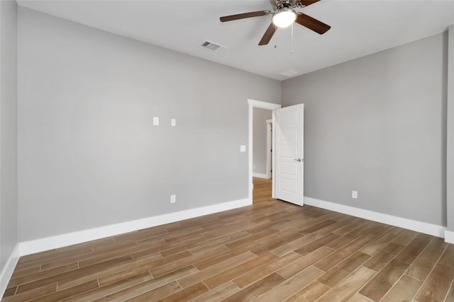 unfurnished room featuring hardwood / wood-style floors and ceiling fan