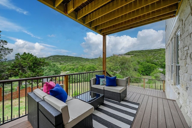 wooden deck featuring an outdoor living space