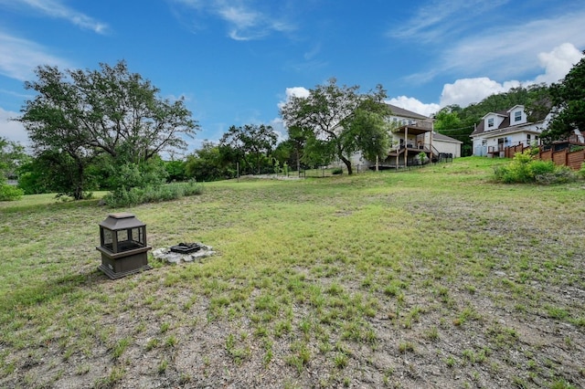 view of yard with a fire pit