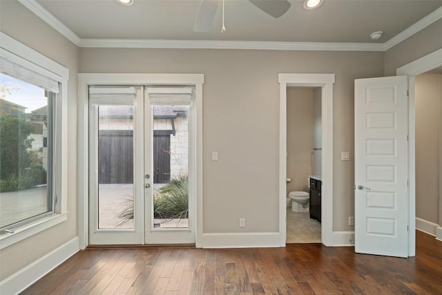 doorway to outside featuring ornamental molding, ceiling fan, dark hardwood / wood-style flooring, and french doors