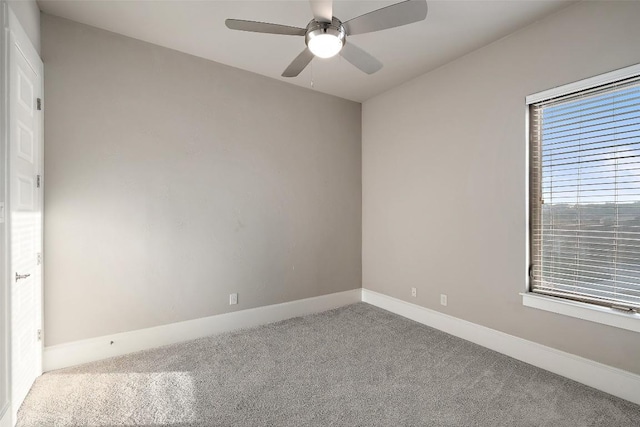 spare room featuring carpet floors and ceiling fan