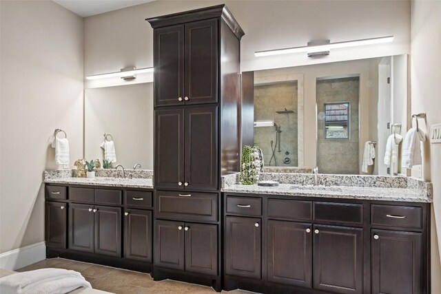 905 Madison Fork Dr, Lakeway, TX 78738 - bathroom featuring a stall shower and double vanity