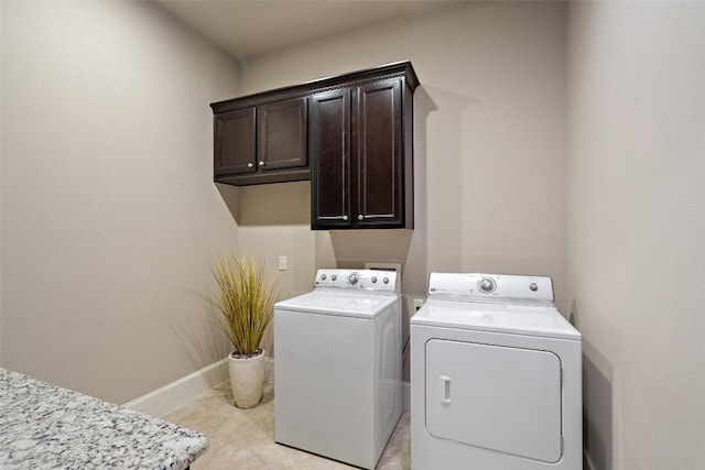 laundry area featuring cabinets and independent washer and dryer