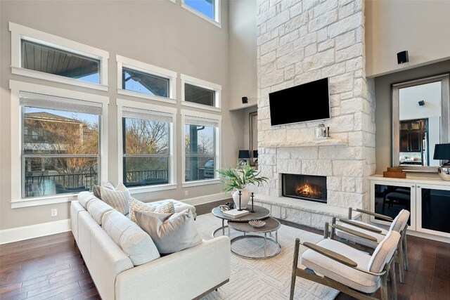905 Madison Fork Dr, Lakeway, TX 78738 - living area featuring a fireplace, dark wood finished floors, and a high ceiling