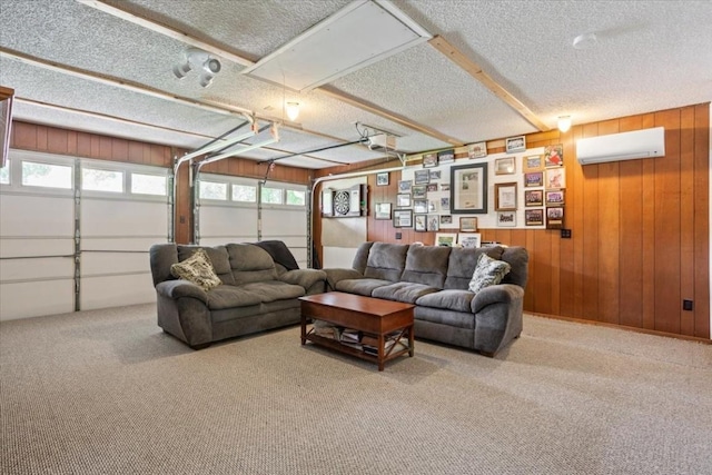 carpeted living room with a wall unit AC, a textured ceiling, and wood walls