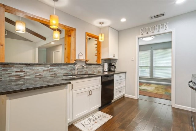 kitchen featuring hanging light fixtures, dishwasher, sink, and white cabinets