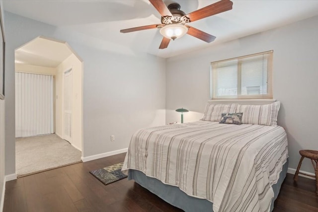 bedroom with dark wood-type flooring and ceiling fan