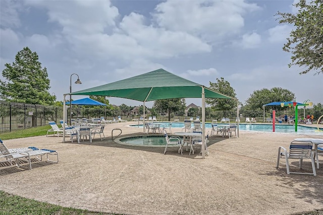 view of swimming pool featuring a patio area