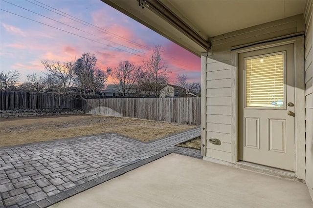 view of patio terrace at dusk