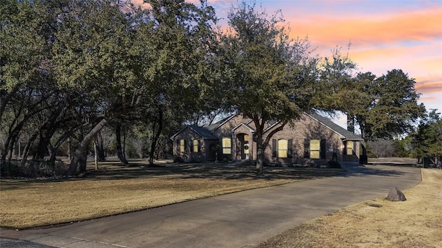 view of front of property with a lawn