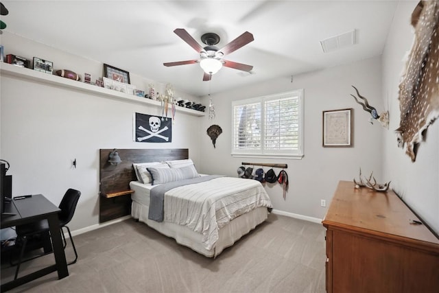 bedroom with ceiling fan and carpet floors