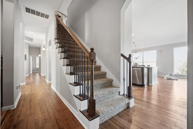 stairs featuring wood-type flooring