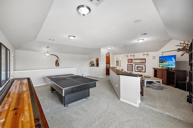 playroom featuring lofted ceiling and carpet