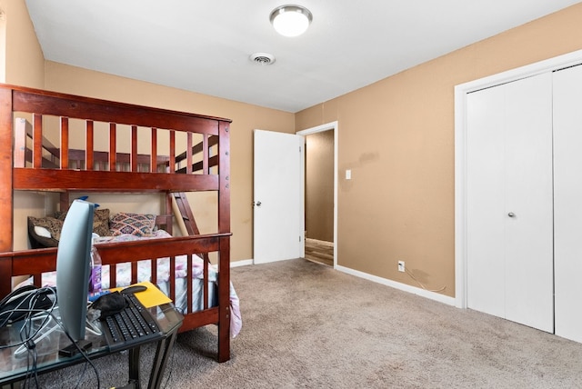 bedroom with a closet and carpet