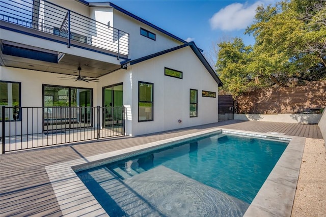 view of swimming pool with ceiling fan and a patio