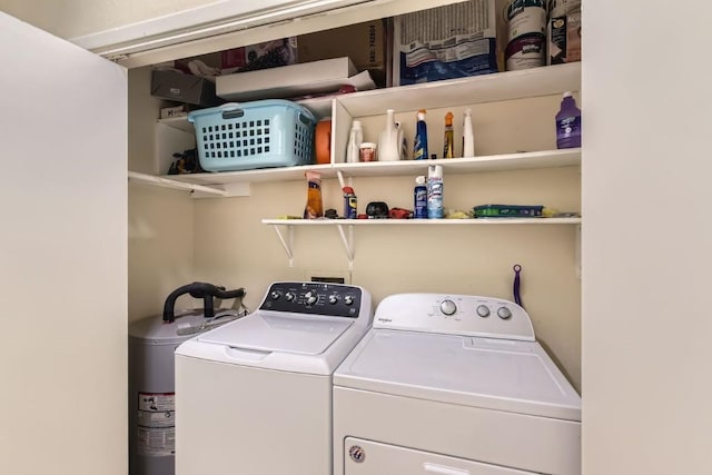 laundry area featuring washer and clothes dryer and electric water heater