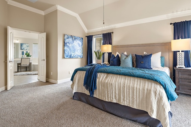 carpeted bedroom with crown molding, ensuite bath, and vaulted ceiling