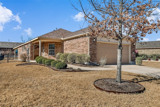 ranch-style house with a garage and a front lawn