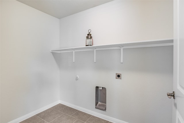 washroom with tile patterned floors, hookup for a gas dryer, and electric dryer hookup