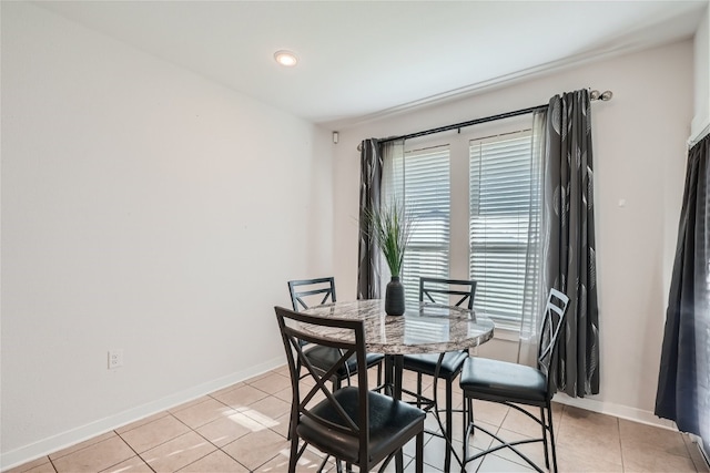 dining area with light tile patterned flooring