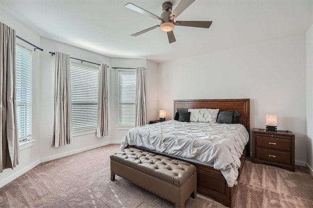 bedroom with multiple windows, carpet, and ceiling fan