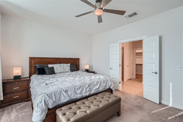 bedroom with light colored carpet and ceiling fan