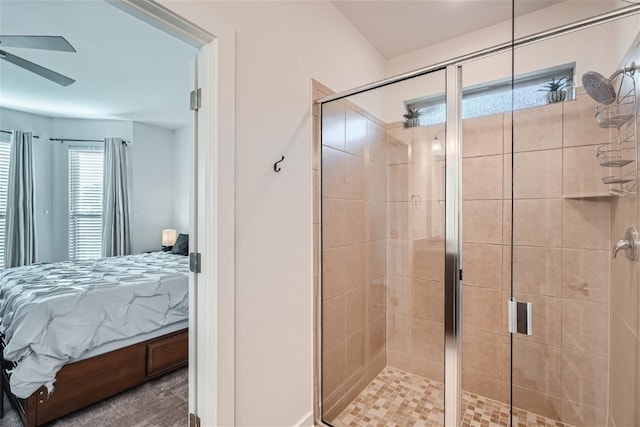 bathroom with a shower with door and ceiling fan