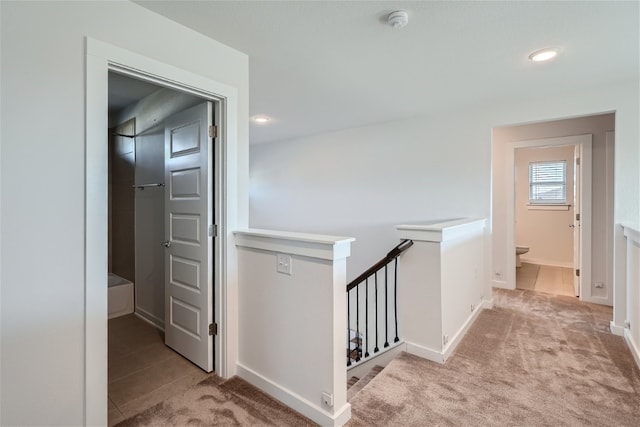 hallway with light carpet