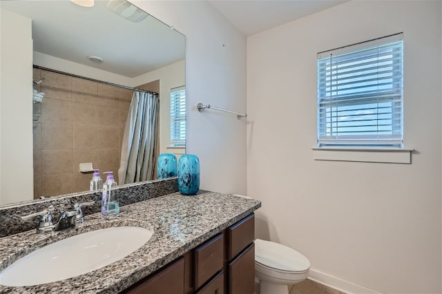 bathroom with vanity, toilet, and a shower with shower curtain