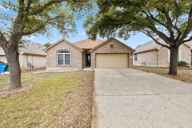 ranch-style house with a garage and a front yard