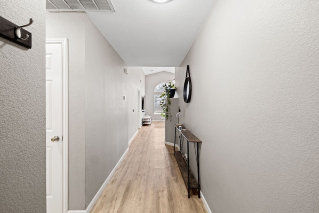 hall with light wood-type flooring