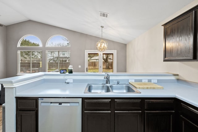 kitchen featuring sink, dark brown cabinets, vaulted ceiling, and dishwasher