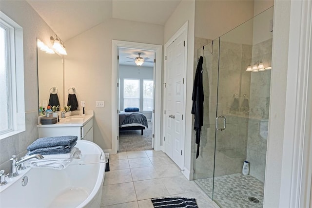 16817 Adoro Dr, Manor, TX 78653 - ensuite bathroom with a bath, a stall shower, tile patterned flooring, vanity, and lofted ceiling
