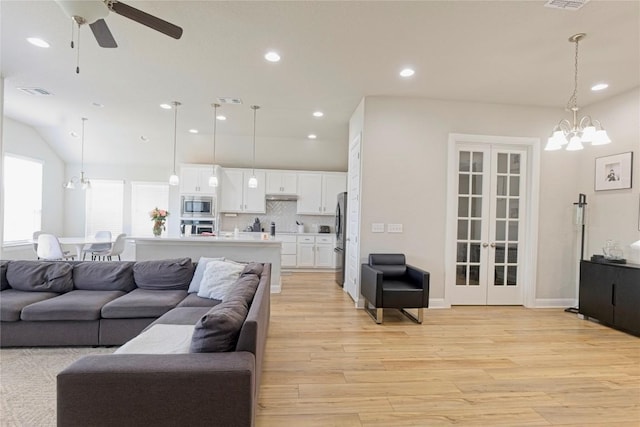 16817 Adoro Dr, Manor, TX 78653 - living area featuring light wood-type flooring, a chandelier, french doors, recessed lighting, and a ceiling fan