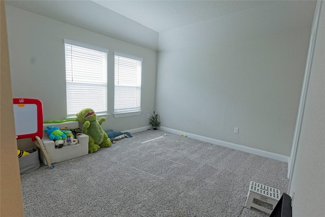 16817 Adoro Dr, Manor, TX 78653 - playroom featuring carpet flooring, baseboards, and lofted ceiling