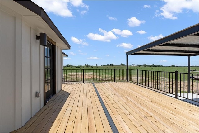 wooden deck featuring a rural view