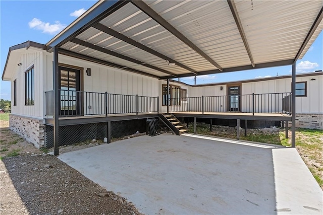 view of patio / terrace with a porch and a carport