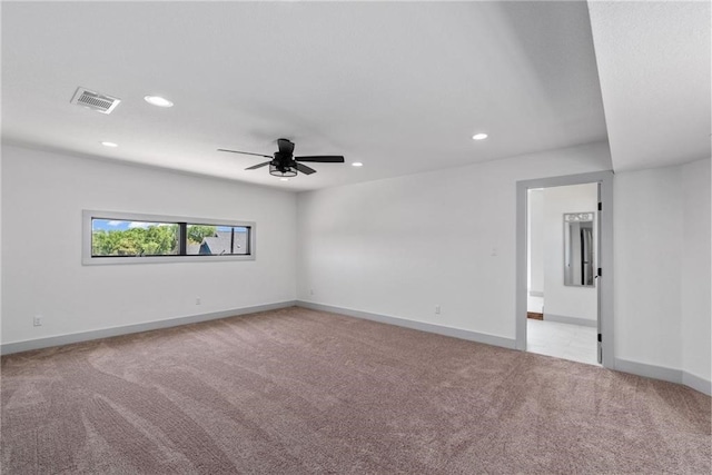 carpeted empty room featuring ceiling fan